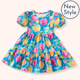 Colorful dress with fruit pattern on a white background