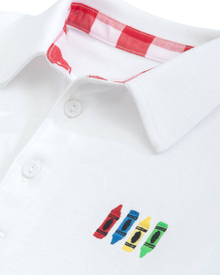 White polo shirt with colorful crayon design on collar