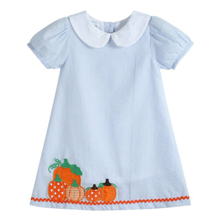 Children's dress with blue and white striped pattern and orange pumpkins on a white background