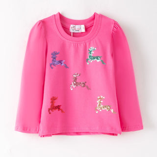 A bright pink long-sleeve children's top with sequined deer appliqués in purple, green, pink, red, and gold, displayed flat against a white background.