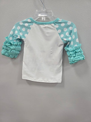 Baby outfit with polka dot headband and bloomers on a gray background