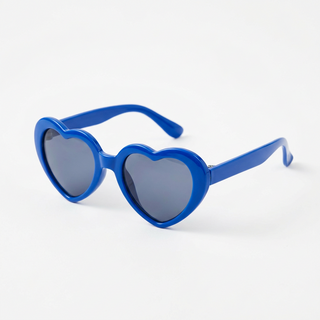 Blue heart-shaped sunglasses with dark gray lenses, photographed on a clean white background.